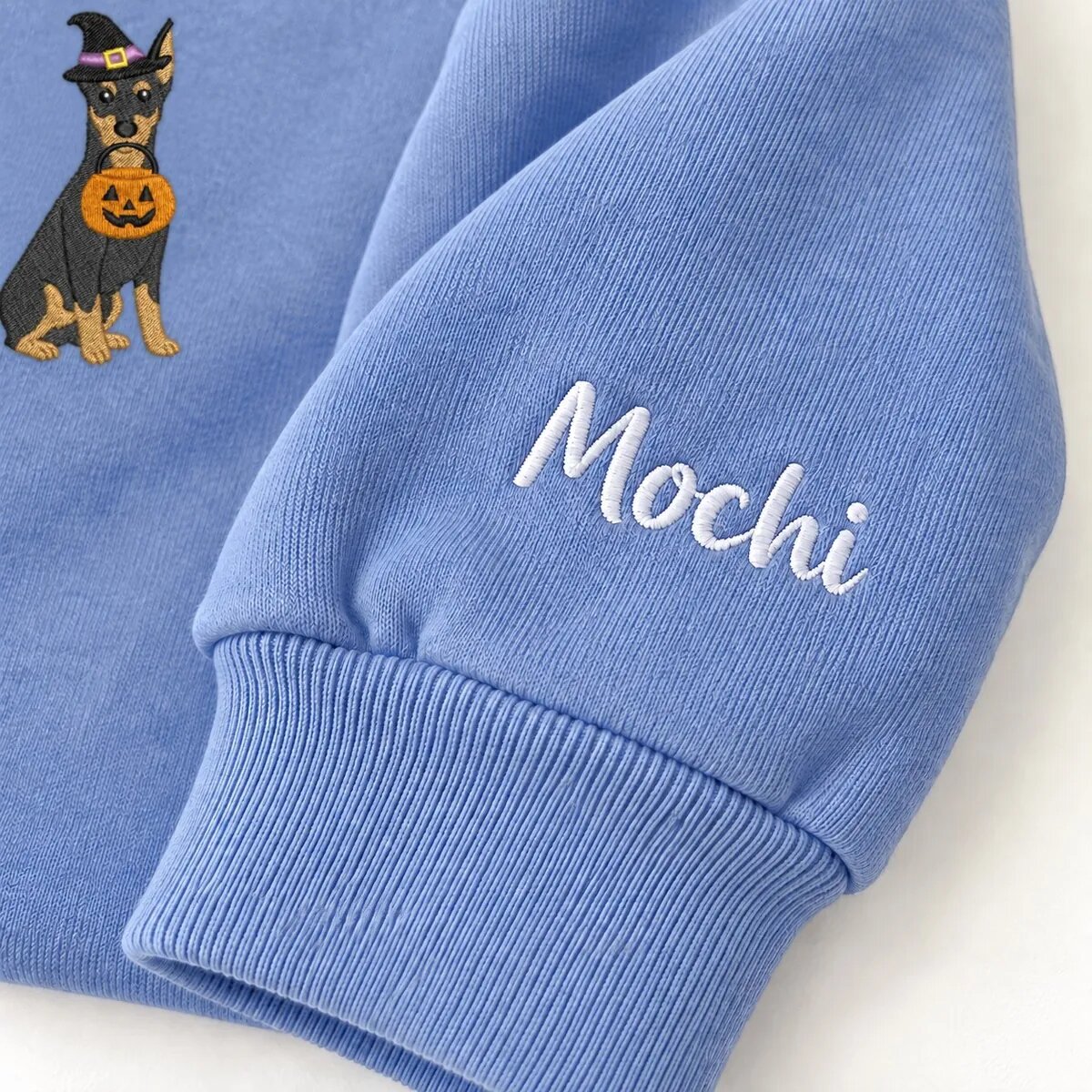 Custom Doberman Sweatshirt – Name on the Sleeve Custom Doberman sweatshirt with the dog name Mochi embroidered on the sleeve