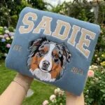 Custom dog crewneck in blue with an embroidered Australian Shepherd face, the name SADIE in varsity letters and EST 2023
