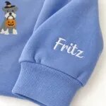 Custom Miniature Schnauzer sweatshirt with the dog name Fritz embroidered on the sleeve