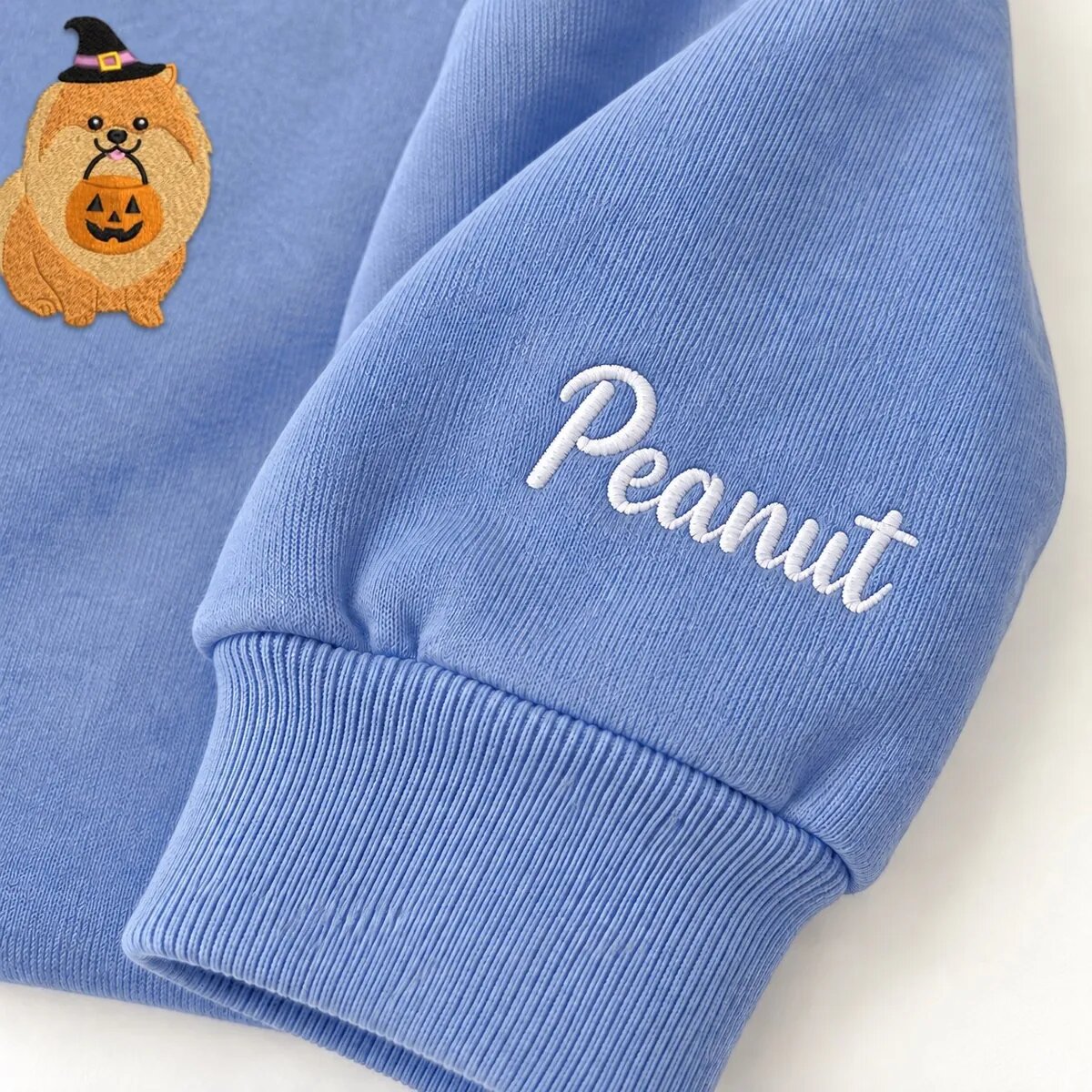 Custom Pomeranian Sweatshirt – Name on the Sleeve Custom Pomeranian sweatshirt with the dog name Peanut embroidered on the sleeve