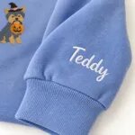 Custom Yorkie sweatshirt with the dog name Teddy embroidered on the sleeve