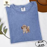 Blue Jean Comfort Colors T-shirt embroidered with a gold and white Shih Tzu puppy with a long silky coat and a plumed tail