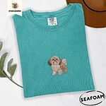 Seafoam Comfort Colors T-shirt embroidered with a gold and white Shih Tzu puppy with a long silky coat and a plumed tail