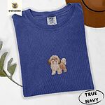 True Navy Comfort Colors T-shirt embroidered with a gold and white Shih Tzu puppy with a long silky coat and a plumed tail
