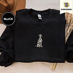 Black crewneck sweatshirt with a brown felt hat and dried bunny tail grass, embroidered with a sitting Dalmatian in white with black spots and a black outline