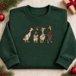 Embroidered Christmas duck sweatshirt in Forest Green with four ducks in Santa hats and Christmas lights across the chest