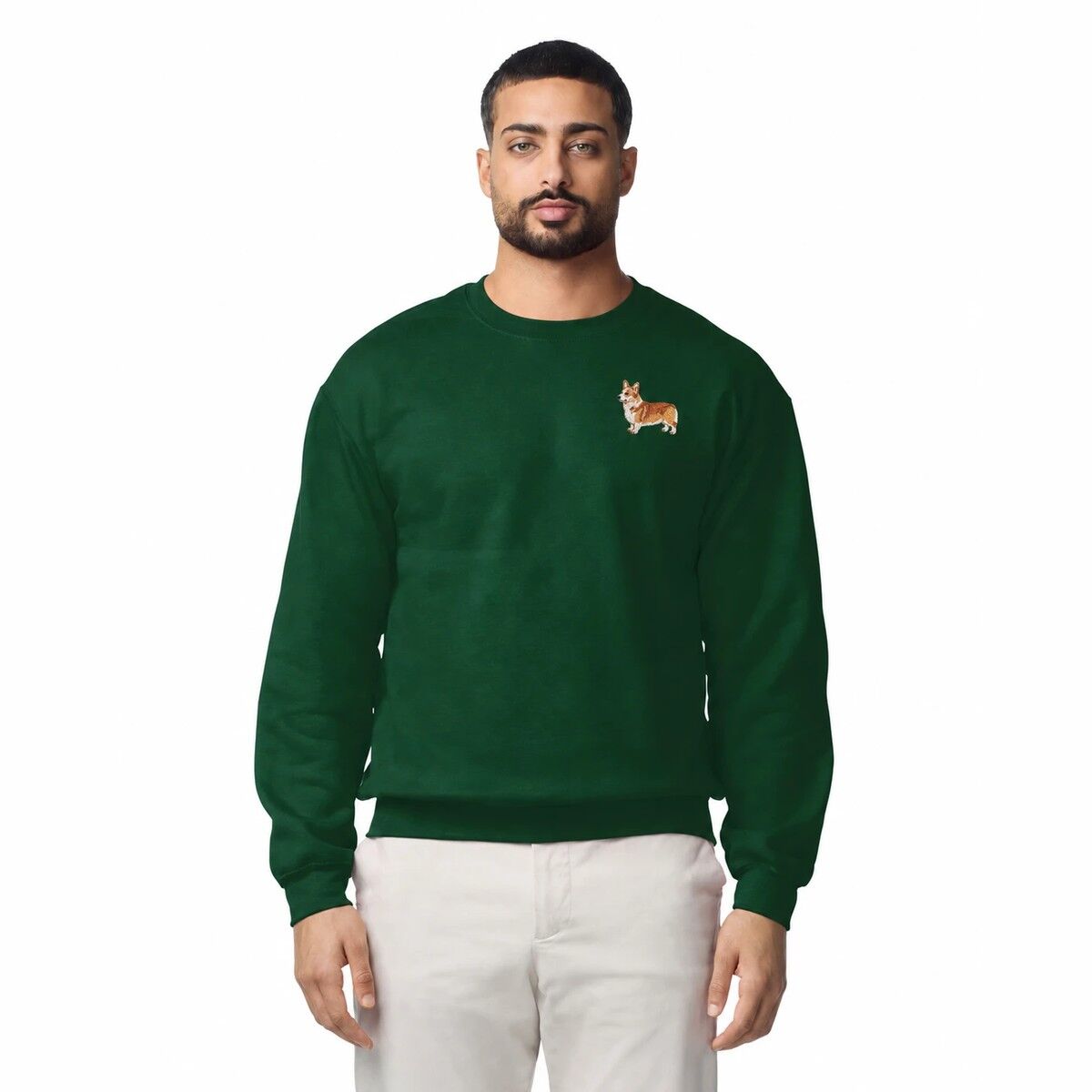 Embroidered Corgi Sweatshirt – Forest Green Man wearing a Forest Green embroidered corgi sweatshirt with a mini red and white corgi on the left chest