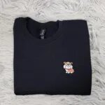 Embroidered English bulldog sweatshirt in Black with a smiling mini bulldog in a red collar on the left chest