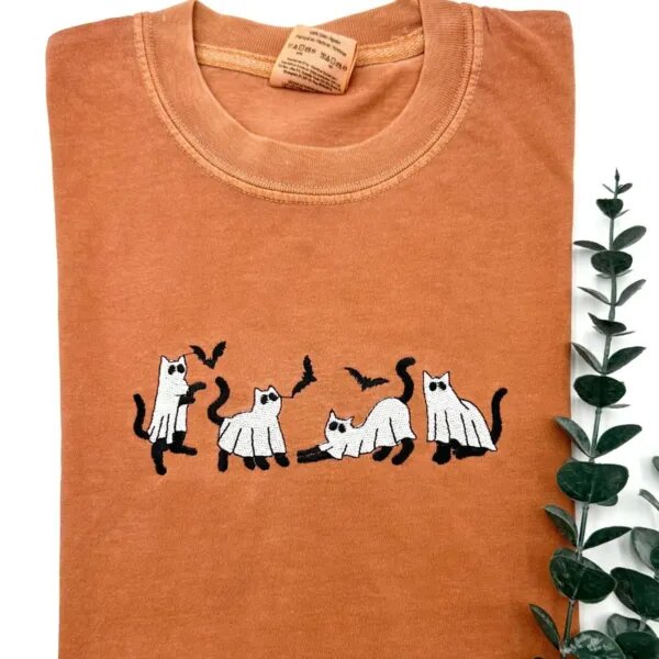 Yam orange T-shirt with four embroidered ghost cats and bats across the chest