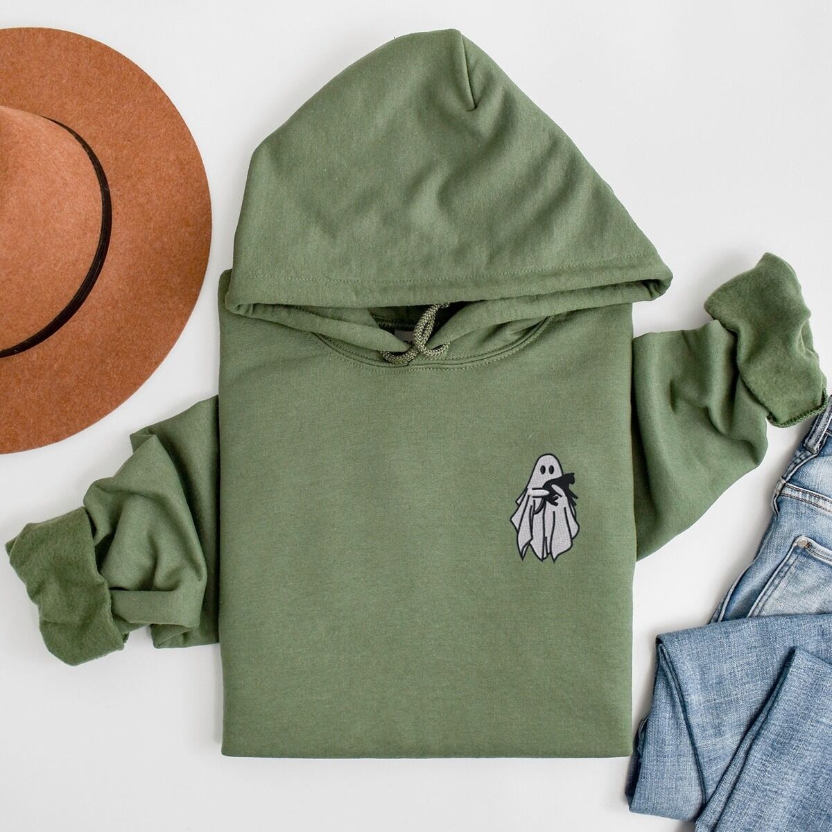 Embroidered Ghost Hoodie – Military Green Military Green Gildan 18500 hoodie embroidered with a little white ghost hugging a black cat on the left chest