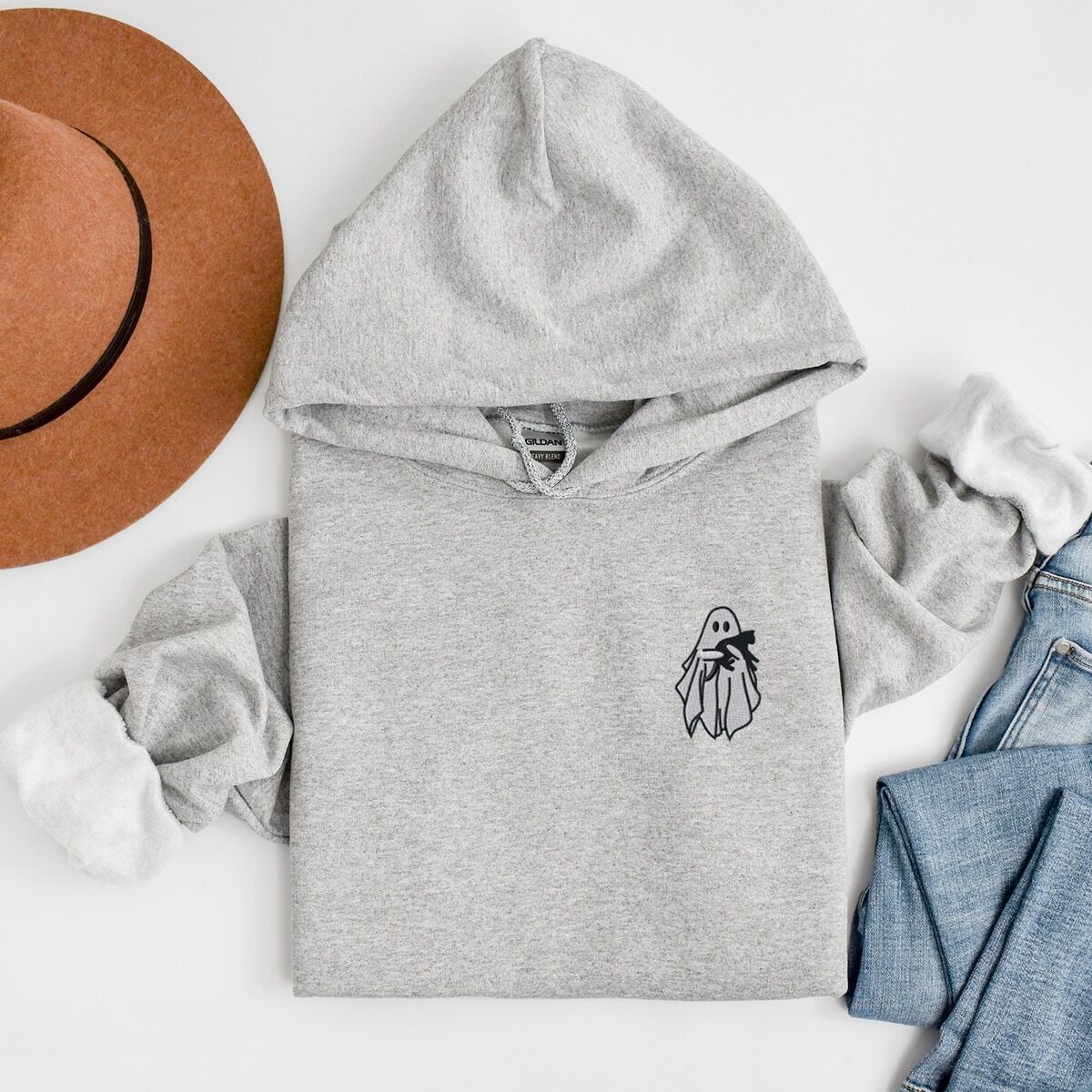 Embroidered Ghost Hoodie – Sport Grey Sport Grey Gildan 18500 hoodie embroidered with a little white ghost hugging a black cat on the left chest