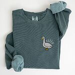 Blue Spruce crewneck sweatshirt laid flat, embroidered with a white goose and the word silly in white thread on the left chest