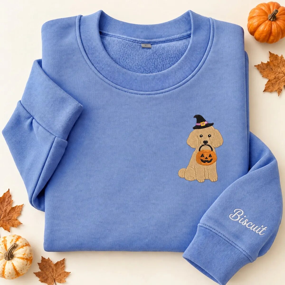 Embroidered Miniature Poodle Halloween Sweatshirt – Heather Deep Royal Embroidered Miniature Poodle Halloween sweatshirt in Heather Deep Royal with a witch-hat Miniature Poodle holding a pumpkin bucket on the left chest