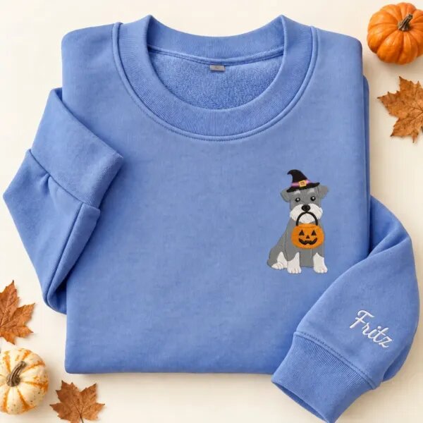 Embroidered Miniature Schnauzer Halloween sweatshirt in Heather Deep Royal with a witch-hat Miniature Schnauzer holding a pumpkin bucket on the left chest