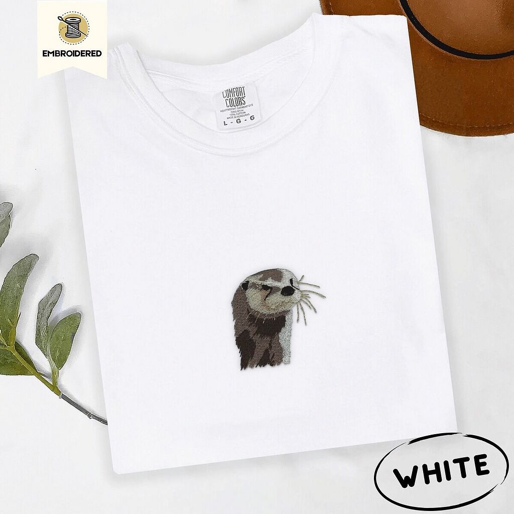 Comfort Colors 1717 T-shirt in White with an embroidered river otter head