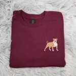 Embroidered pitbull shirt in maroon with a small fawn and white pit bull stitched on the left chest like a pocket logo