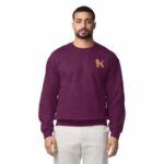 Man wearing a Maroon embroidered poodle sweatshirt with a mini apricot poodle on the left chest