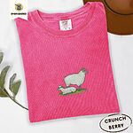 Crunchberry Comfort Colors T-shirt embroidered with a woolly white ewe standing over her lamb resting on green grass