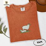 Yam Comfort Colors T-shirt embroidered with a woolly white ewe standing over her lamb resting on green grass