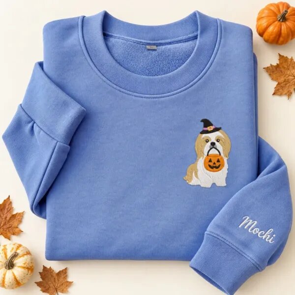 Embroidered Shih Tzu Halloween sweatshirt in Heather Deep Royal with a witch-hat Shih Tzu holding a pumpkin bucket on the left chest