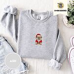 Ash crewneck sweatshirt folded with denim shorts, white sneakers and a potted plant, embroidered with a fawn English bulldog in a red Santa suit, black belt and Santa hat