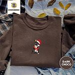 Dark Chocolate crewneck sweatshirt on a plaid flannel shirt with yellow autumn leaves and denim shorts, embroidered with a black French bulldog with a cream chest in a Santa hat and a red scarf with white zigzag stripes