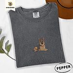 Pepper Comfort Colors T-shirt embroidered with a black and tan German shepherd lying down with its ears up and its paws forward
