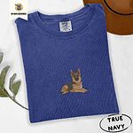True Navy Comfort Colors T-shirt embroidered with a black and tan German shepherd lying down with its ears up and its paws forward