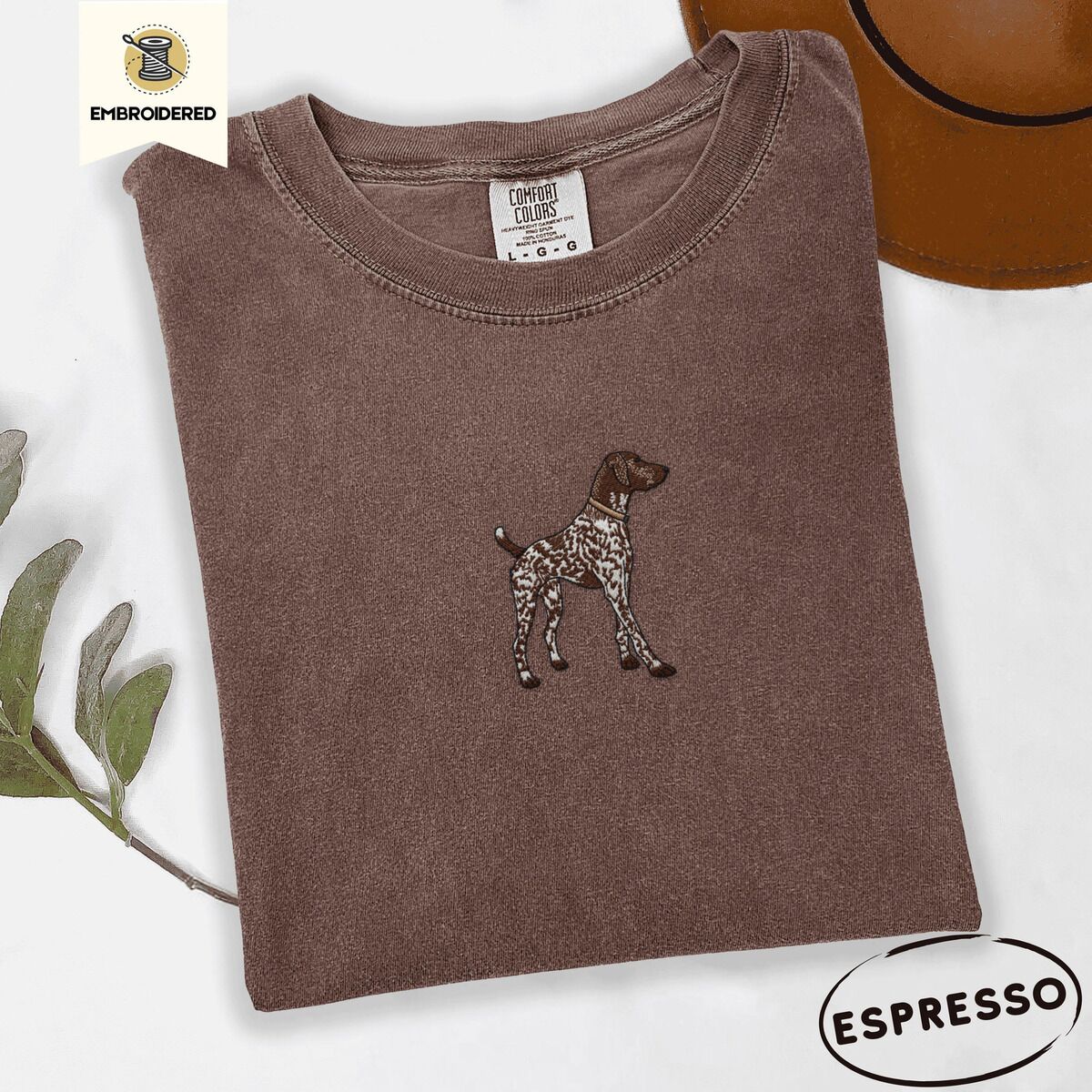 German Shorthaired Pointer Shirt – Espresso Espresso Comfort Colors T-shirt embroidered with a standing liver and white German shorthaired pointer in a tan collar