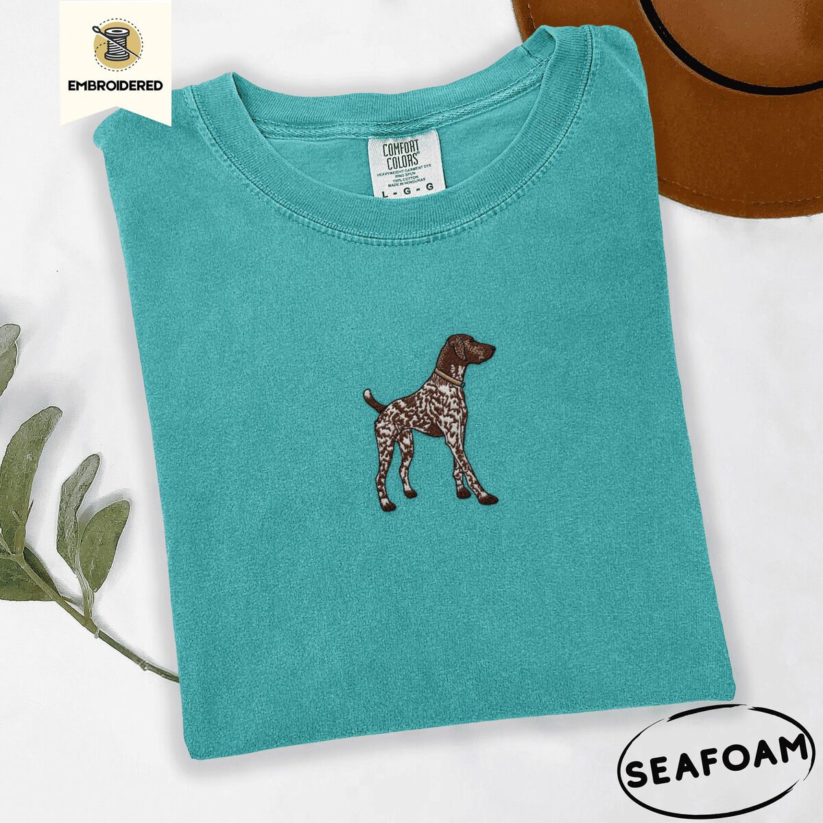 German Shorthaired Pointer Shirt – Seafoam Seafoam Comfort Colors T-shirt embroidered with a standing liver and white German shorthaired pointer in a tan collar