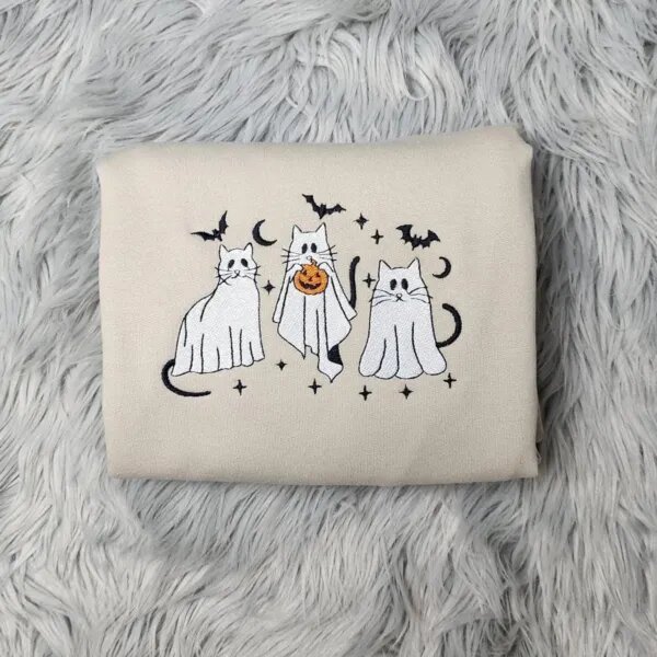 Ghost cat sweatshirt in Sand with three embroidered cats in white ghost sheets, black bats, crescent moons and stars