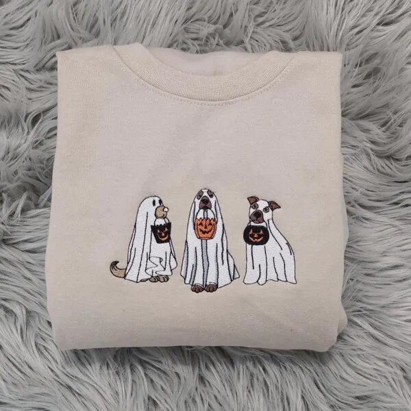 Ghost dog sweatshirt in Sand with three embroidered dogs in white ghost sheets carrying jack-o'-lantern buckets
