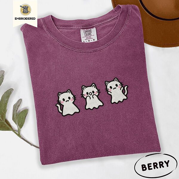 Berry Comfort Colors T-shirt embroidered with three white ghost kittens with pink cheeks and black outlines