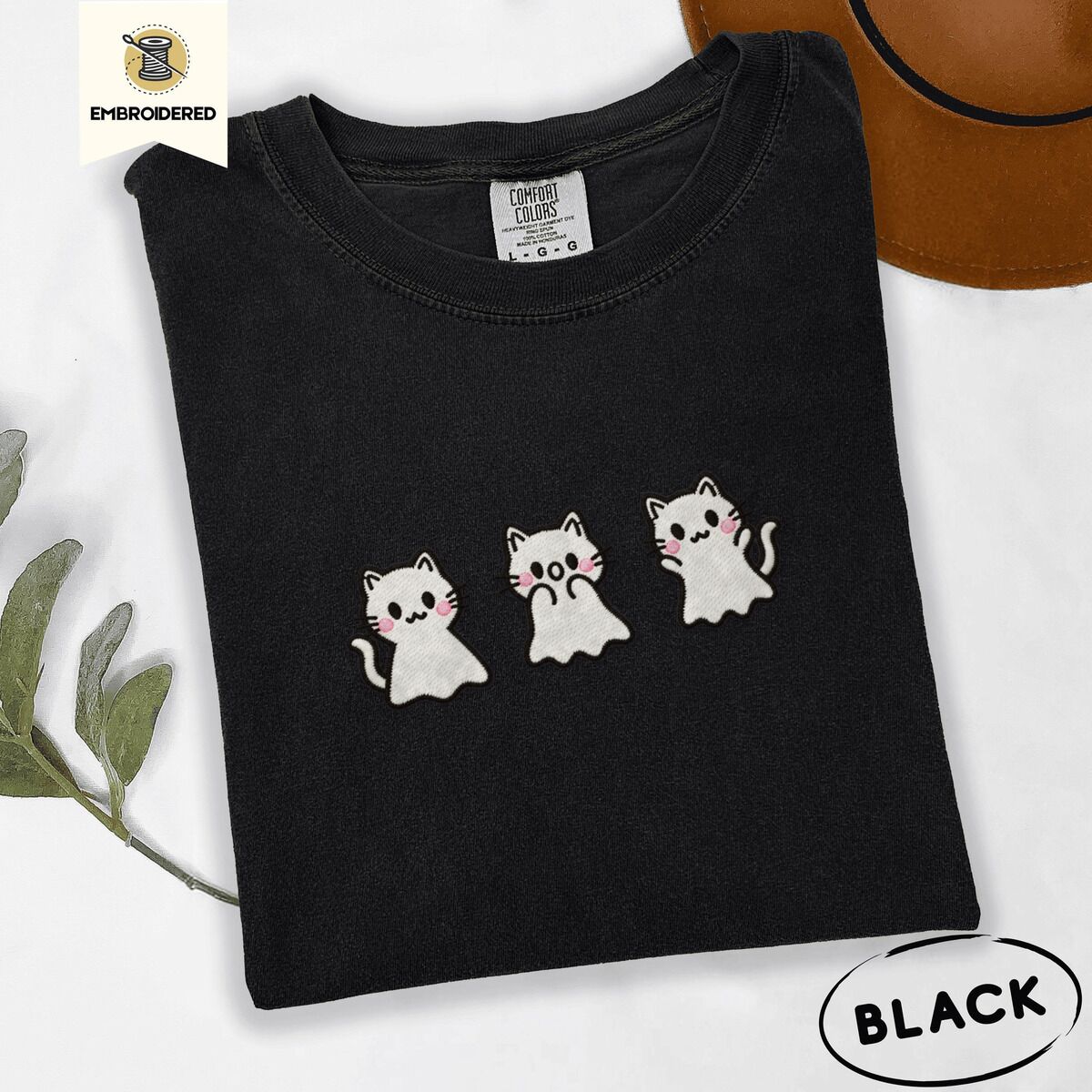 Ghost Kitten Shirt – Black Black Comfort Colors T-shirt embroidered with three white ghost kittens with pink cheeks and black outlines