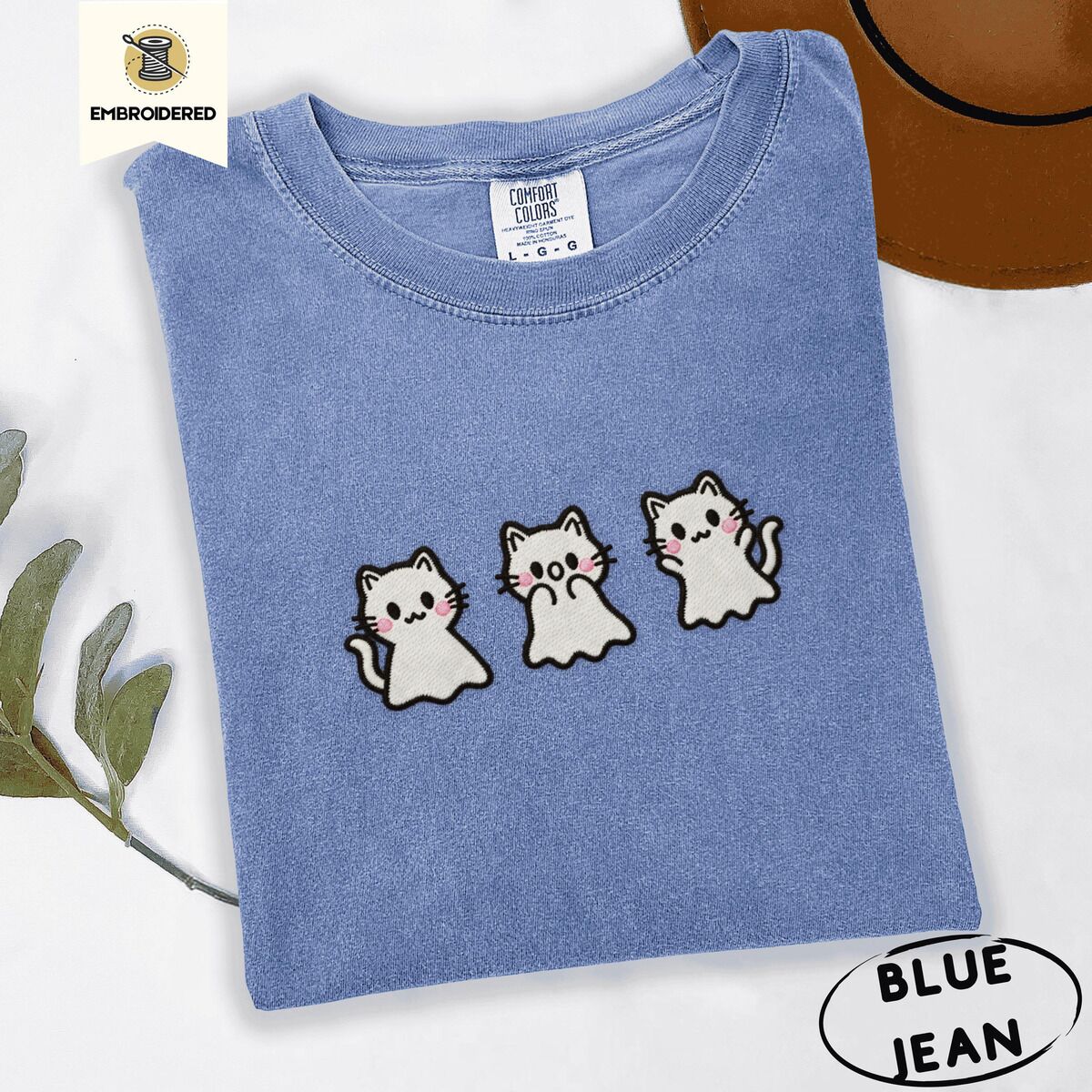 Ghost Kitten Shirt – Blue Jean Blue Jean Comfort Colors T-shirt embroidered with three white ghost kittens with pink cheeks and black outlines