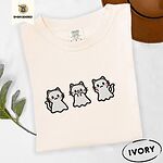 Ivory Comfort Colors T-shirt embroidered with three white ghost kittens with pink cheeks and black outlines