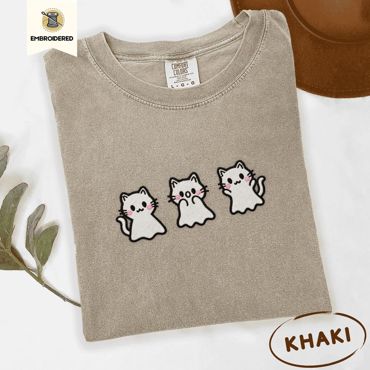 Ghost Kitten Shirt – Khaki Khaki Comfort Colors T-shirt embroidered with three white ghost kittens with pink cheeks and black outlines