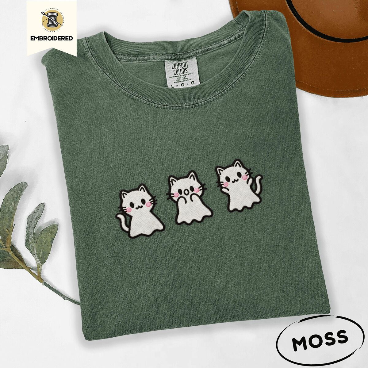 Ghost Kitten Shirt – Moss Moss Comfort Colors T-shirt embroidered with three white ghost kittens with pink cheeks and black outlines