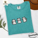 Seafoam Comfort Colors T-shirt embroidered with three white ghost kittens with pink cheeks and black outlines