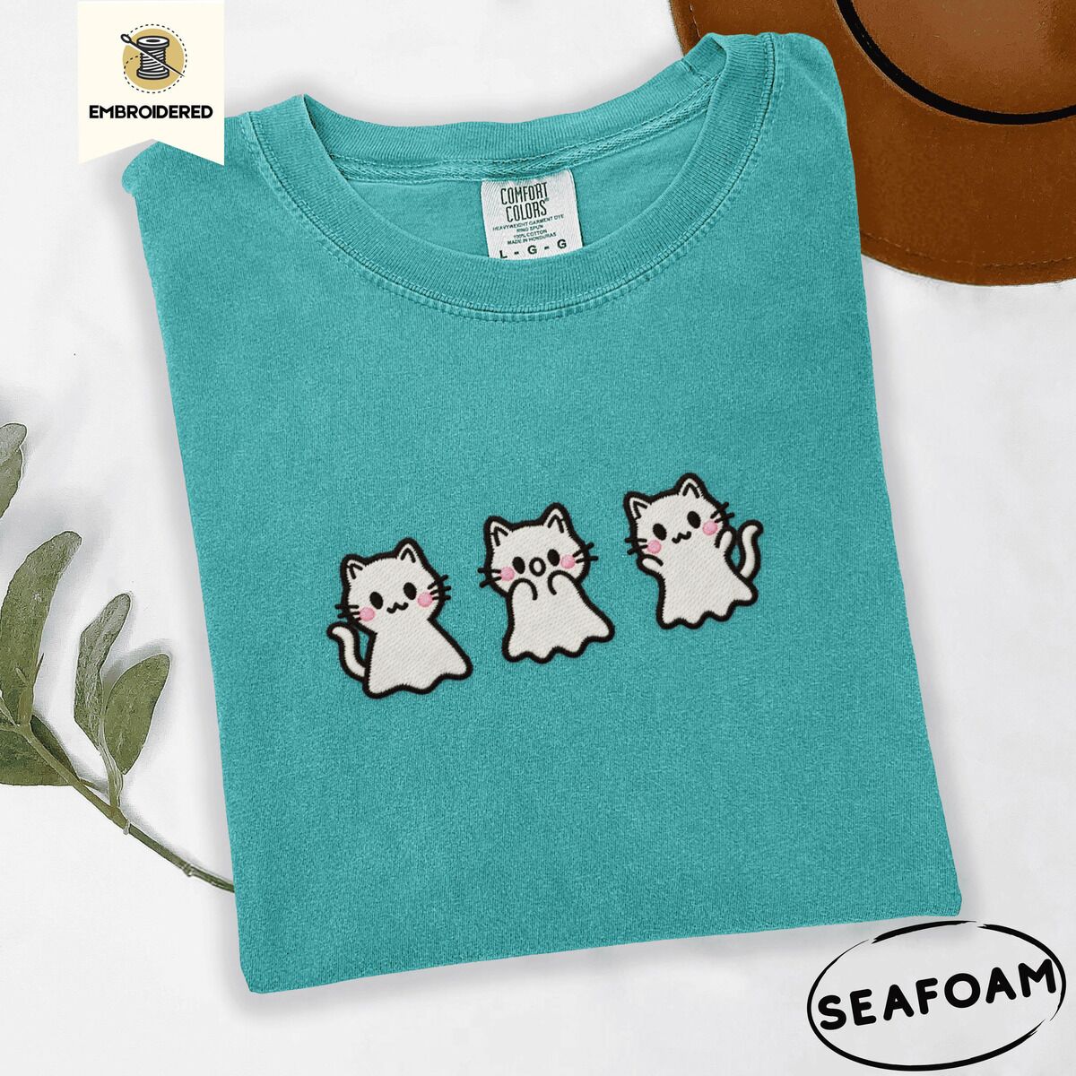 Ghost Kitten Shirt – Seafoam Seafoam Comfort Colors T-shirt embroidered with three white ghost kittens with pink cheeks and black outlines