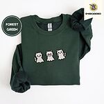 Forest Green crewneck sweatshirt folded on a white background, embroidered with three white ghost kittens with pink cheeks and black outlines