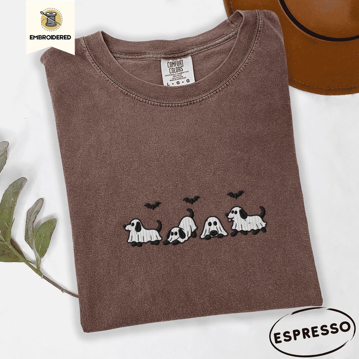Ghost Puppy Shirt – Espresso Espresso Comfort Colors T-shirt embroidered with four puppies in white ghost sheets with black floppy ears and tails under three flying black bats