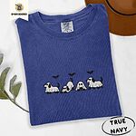 True Navy Comfort Colors T-shirt embroidered with four puppies in white ghost sheets with black floppy ears and tails under three flying black bats