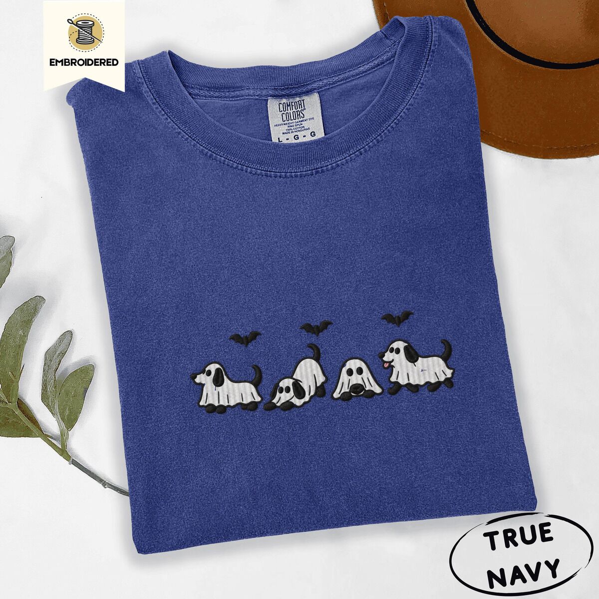 Ghost Puppy Shirt – True Navy True Navy Comfort Colors T-shirt embroidered with four puppies in white ghost sheets with black floppy ears and tails under three flying black bats