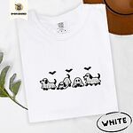 White Comfort Colors T-shirt embroidered with four puppies in white ghost sheets with black floppy ears and tails under three flying black bats