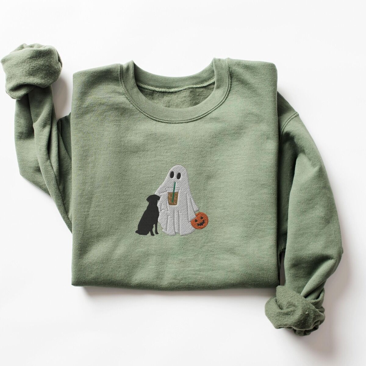 Ghost with Black Lab Sweatshirt – Military Green Military Green crewneck sweatshirt laid flat on a white background, embroidered with a ghost lab mom sipping iced coffee and carrying a jack-o'-lantern pail, with a black lab sitting against her