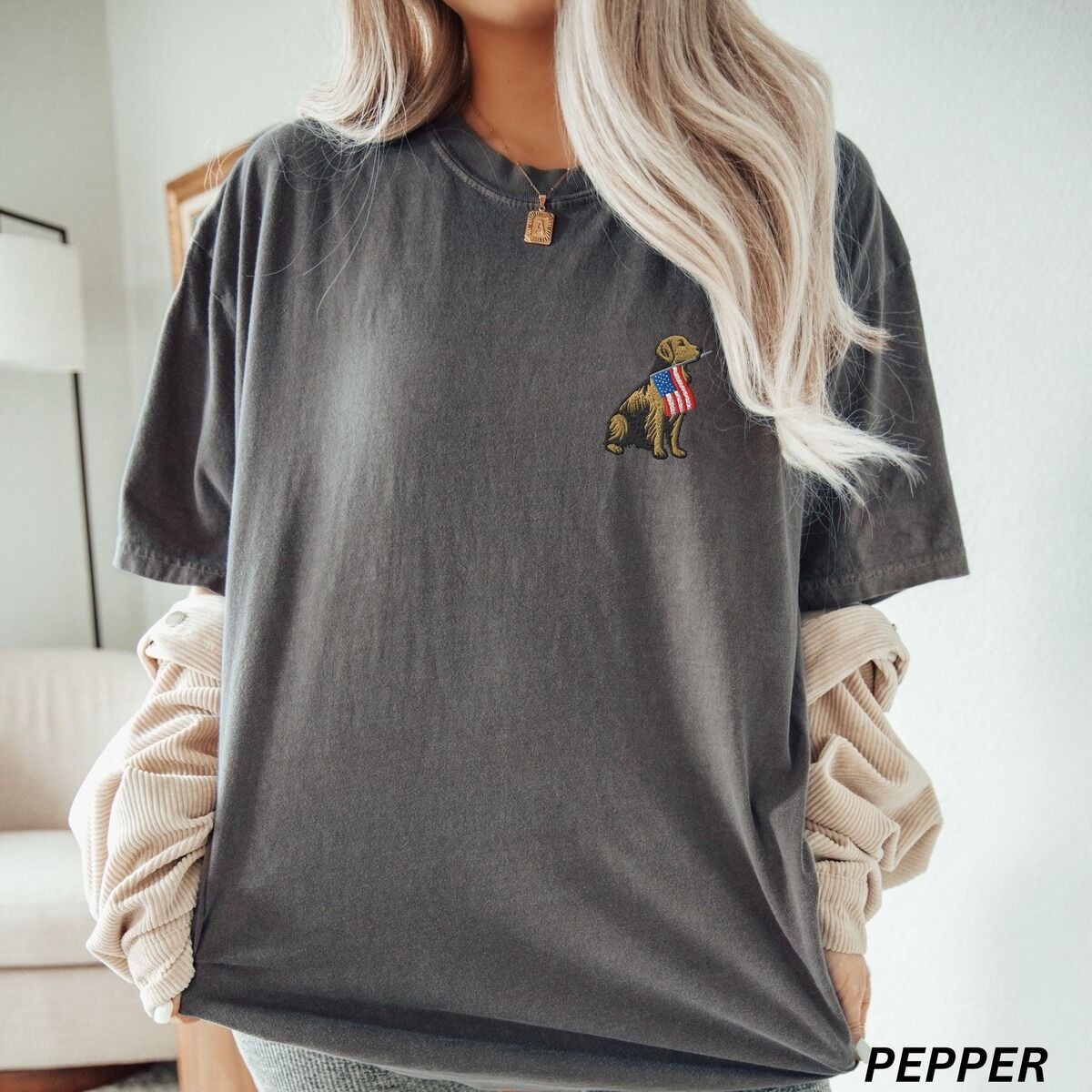 Golden Retriever American Flag Shirt – Pepper Woman in a Pepper T-shirt with a small embroidered golden retriever and American flag on the left chest