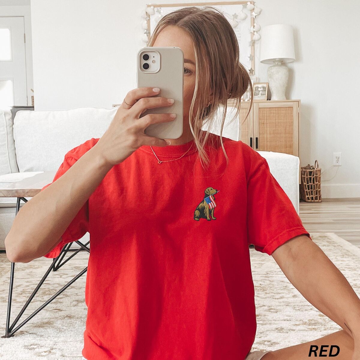 Golden Retriever American Flag Shirt - Red Woman taking a mirror selfie in a Red T-shirt with a small golden retriever and USA flag on the left chest