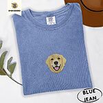 Blue Jean Comfort Colors T-shirt embroidered with a smiling golden retriever face with a pink tongue