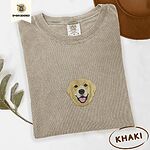 Khaki Comfort Colors T-shirt embroidered with a smiling golden retriever face with a pink tongue